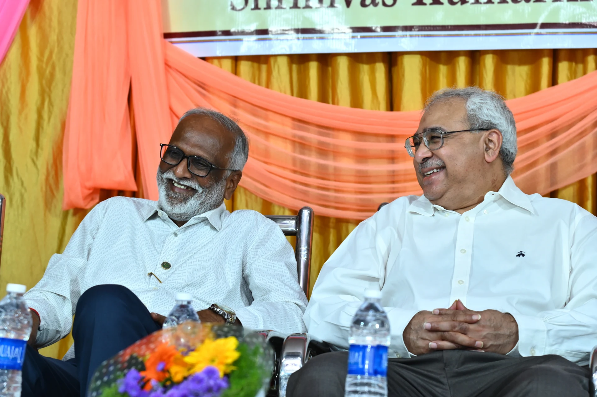 Dr. Girish Kuchinad, Chief Guest, and Dr. Milind Kulkarni, President of the Trust, having a light moment at the 4th anniversary function of the Trust